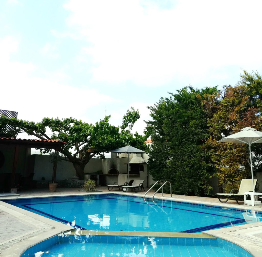 Swimmingpools and a shady patio at the private villa
