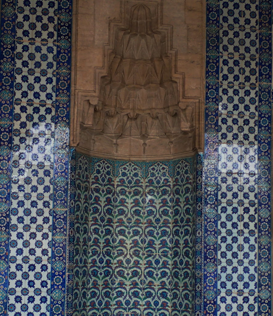 A tiled niche with muqarnas at the Rüstem Pasha Mosque by Mimar Sinan