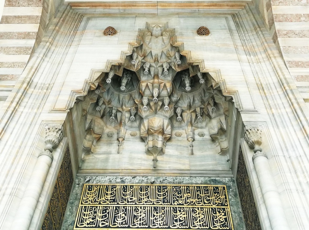 Muqarnas vaulting and calligraphy at the entrance of the Süleymaniye Mosque - Mosque Architecture