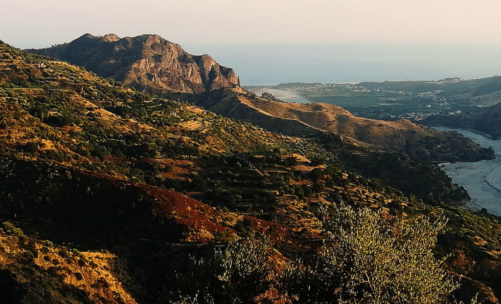 Greece to Sicily by Motorcycle - A rough mountain road in Calabria, the Ionian in the distance