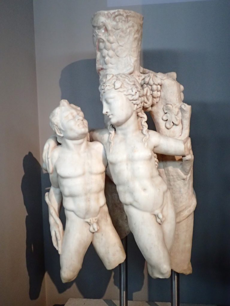 That’s Dionysus embracing a satyr. What’s that coming from the top of his head? This is a Trapezophoron- a table support. It dates from the time around the Pythian games.