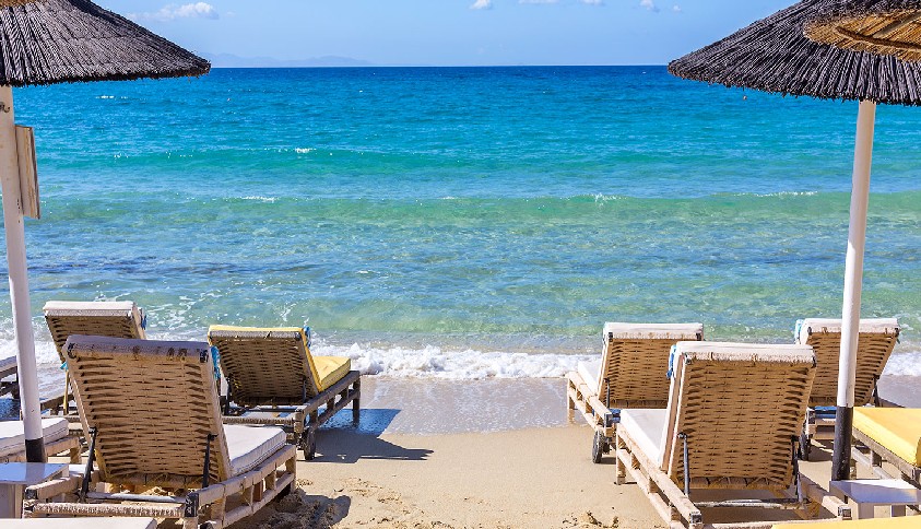 Best things to do in Mykonos - Relaxing as the waves lap the shore