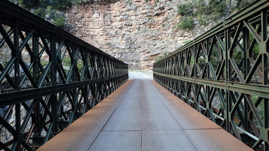 Crossing the Arachthos Gorge over a narrow steel bridge