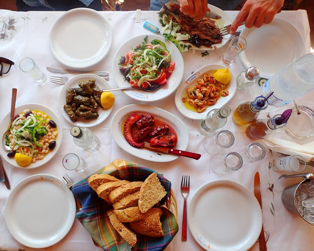 Greek drinks - always with food. Here, a table full of ouzo meze, Skala Kalonis, Lesvos