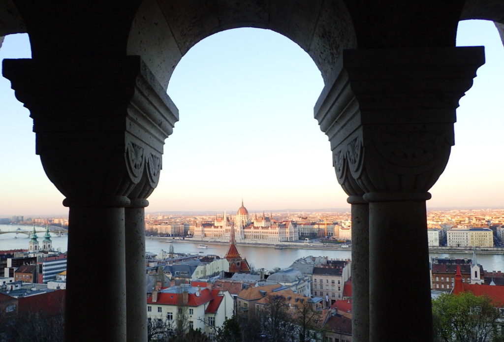 Budapest's Neo-Romanesque Fisherman's Bastion frames the Hungarian Parliament building across the Danube.