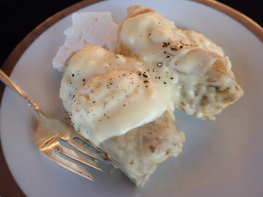 Greek Cabbage Rolls with Avgolemono sauce and feta cheese on the side