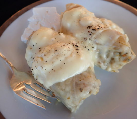 Greek Cabbage Rolls with Avgolemono sauce and feta cheese on the side