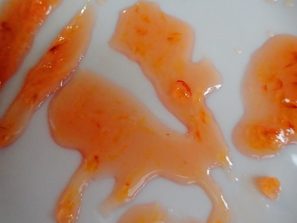 Blood ornage marmalade on a chilled plate to test for thickness