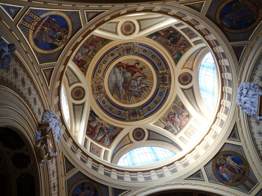 The dramatic, domed ceiling of the grand entrance of the Széchenyi baths sets the tone for one of the world's most elegant bathing experiences - one of the best things to do in Winter in Budapest. 