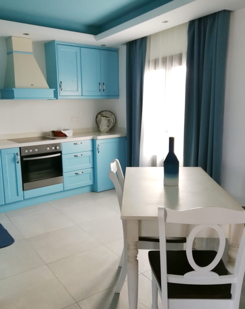 The full modern kitchen in our apartment, in dodecanese blue and white