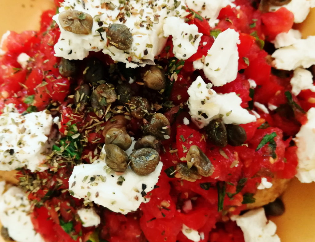 Salad with wild capers and herbs from the island