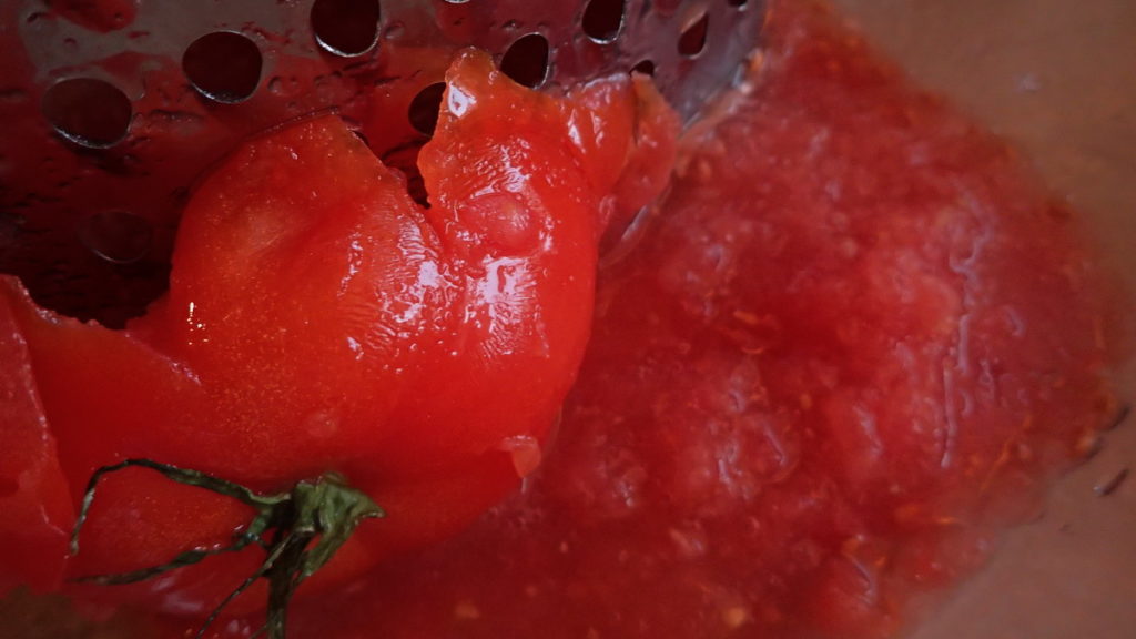 Tomato grated on a box grater for boureki