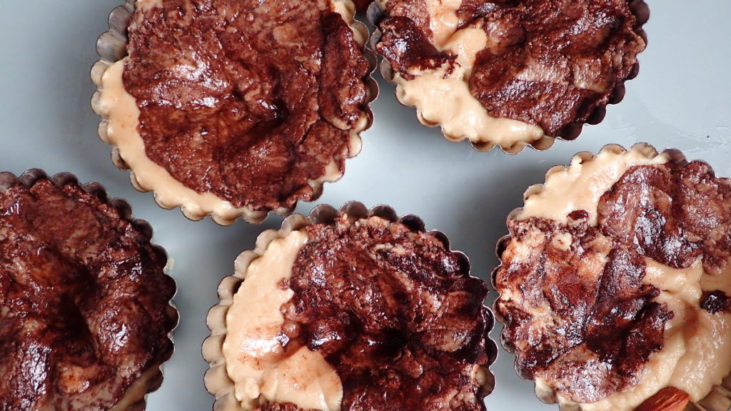 Pressing the tahini halva with cocoa into molds