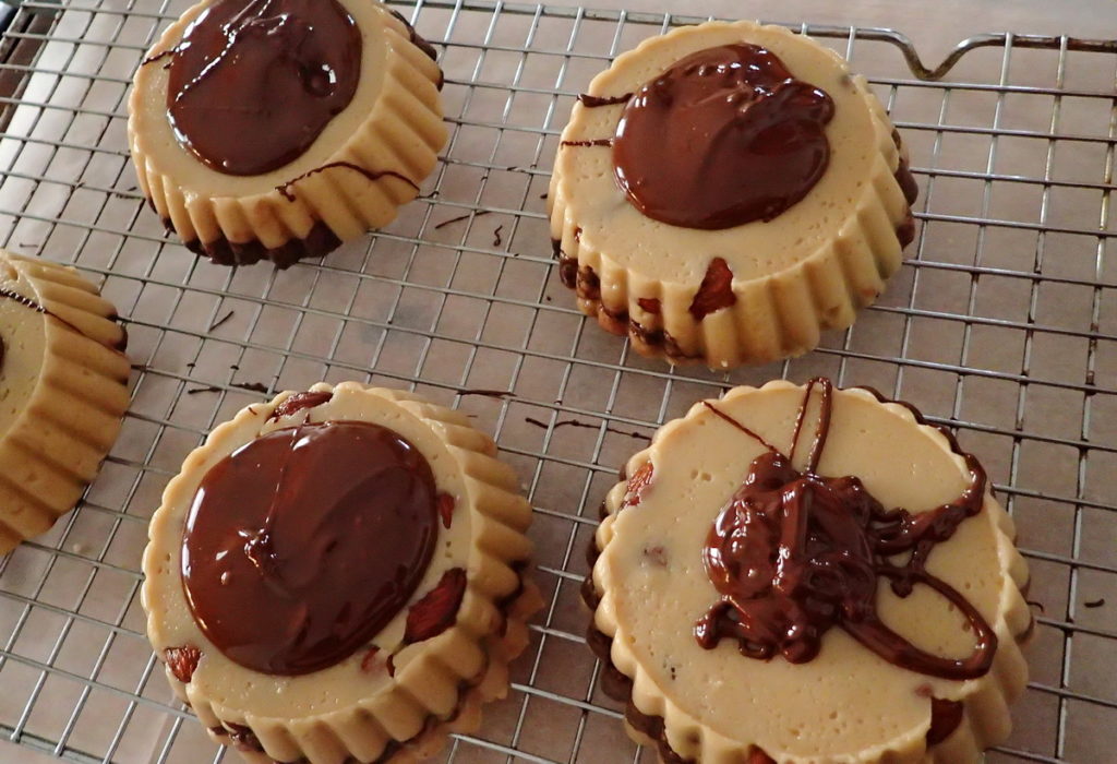 Covering the sesame halva with dark chocolate