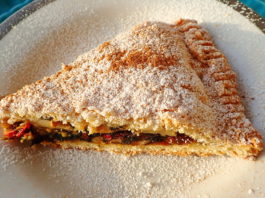 A slice of tourte aux blettes with sugar and cinnamon