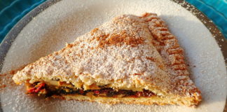 A slice of tourte aux blettes with sugar and cinnamon