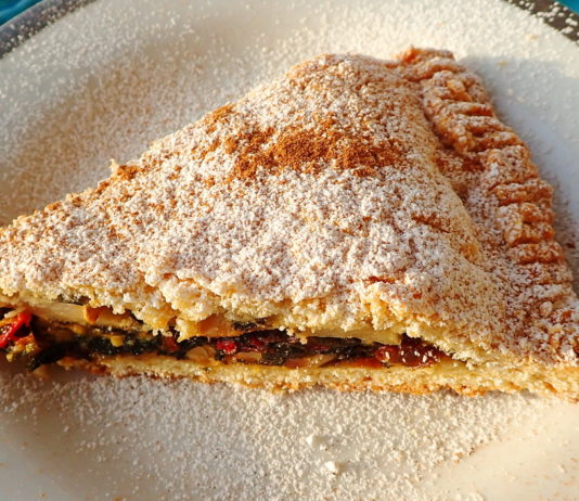 A slice of tourte aux blettes with sugar and cinnamon