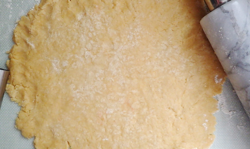 The rolled out pastry crust for a tourte de blette