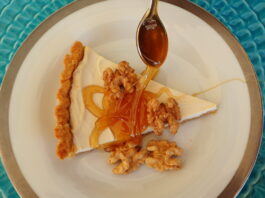 Honey Yogurt Tart sreved with a thick drozzle of honey and shelled walnuts