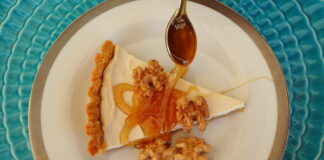 Honey Yogurt Tart sreved with a thick drozzle of honey and shelled walnuts